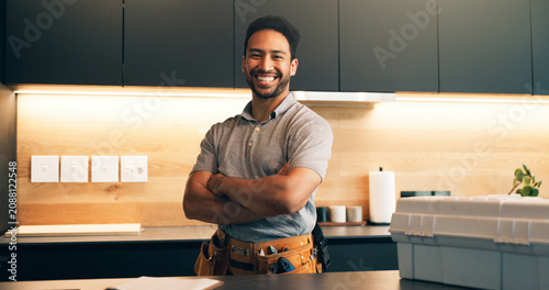 Foto Plumber, tools and portrait of man in kitchen for plumbing service, maintenance and repair