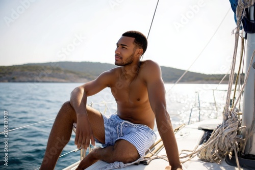 Young Handsome Man Relaxing on His Sailboat