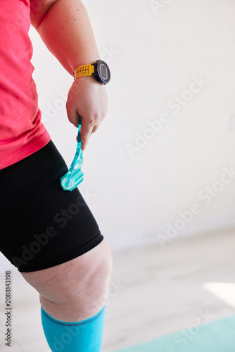 Massaging legs with a roller