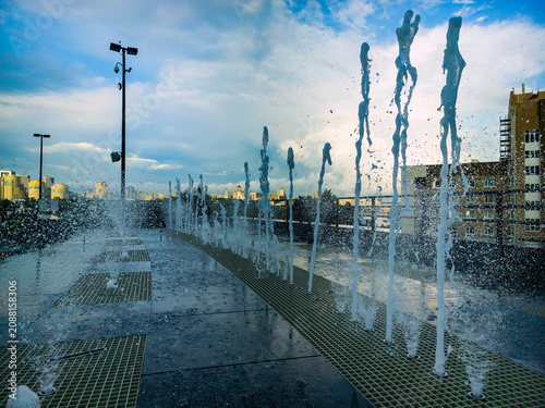 Bild auf Leinwand Water jets splashing up from public dry fountain in Yekaterinburg city center cl