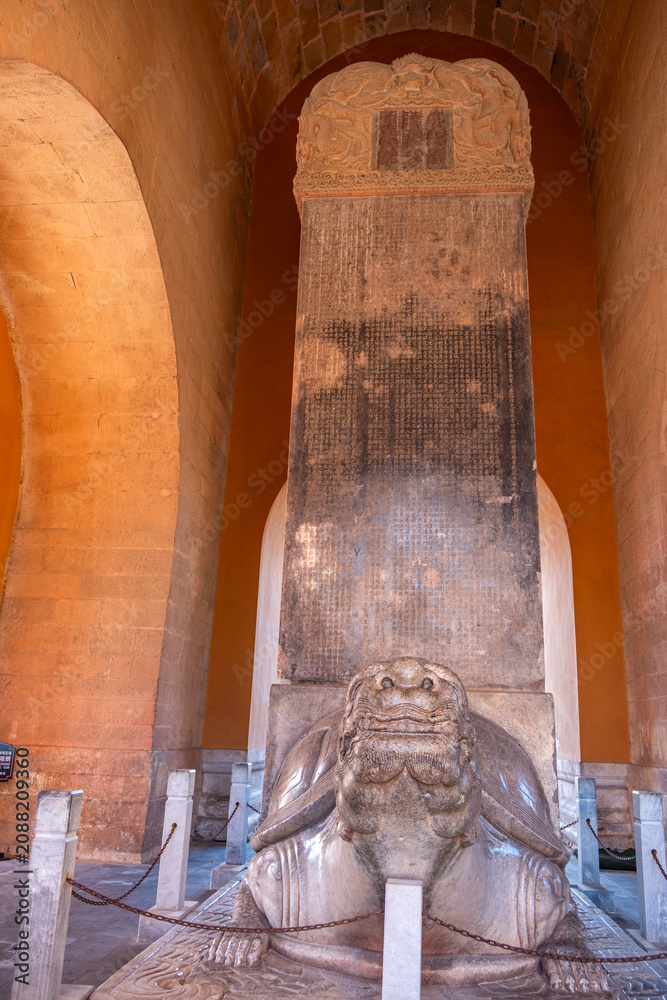 Obraz premium Stone stele on turtle pedestal under brick arches at Ming Tombs, Beijing, China