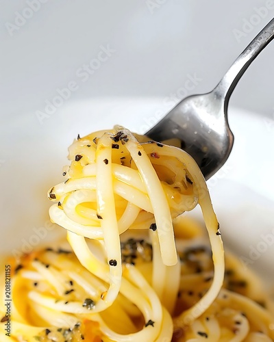Spaghetti Pasta Twirled on Fork in Bowl, Twirled Forkful of Authentic Cacio e Pepe Pasta