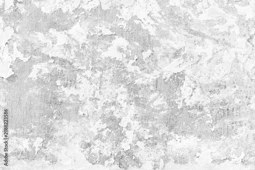Grunge white concrete wall texture background. Rough old cement plaster wall with peeling paint and scratches.