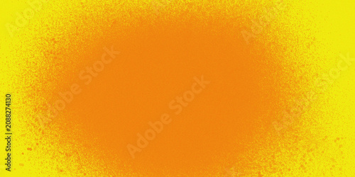 Vibrant orange powder texture on yellow background with gradient effect and speckled pattern