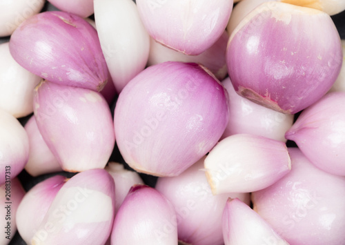 Whole fresh peeled Thai shallots for background, Top view