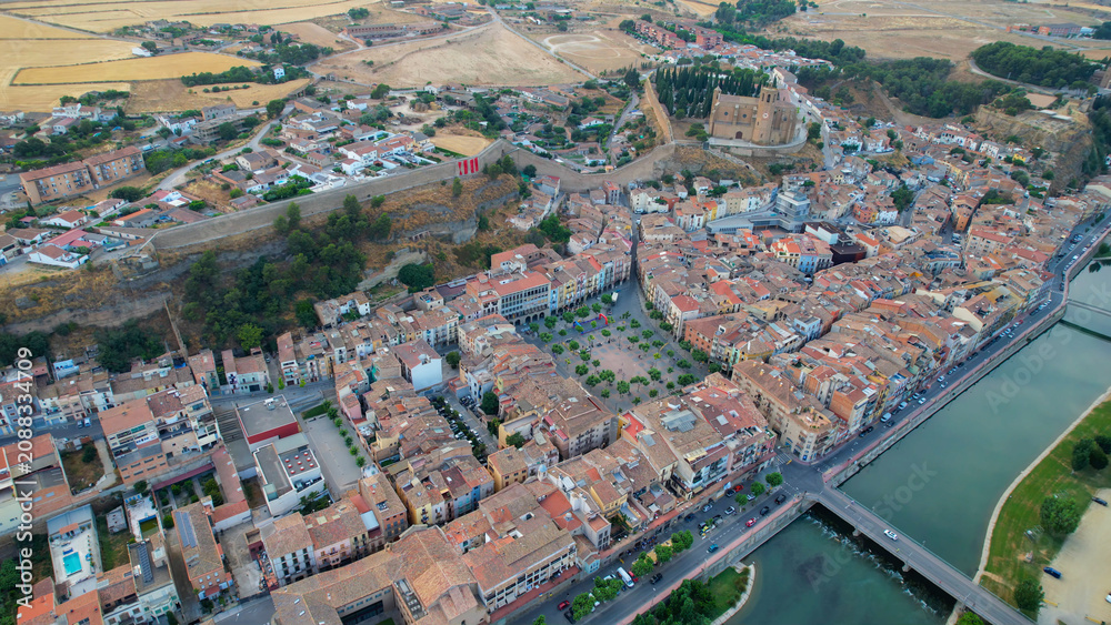 Fototapeta premium Aerial view of the downtown above the city and Balaguer in Spain, on a sunny spring afternoon.