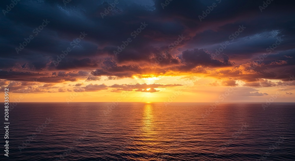 Fototapeta premium Dramatic Sunset Over Calm Ocean Waters
