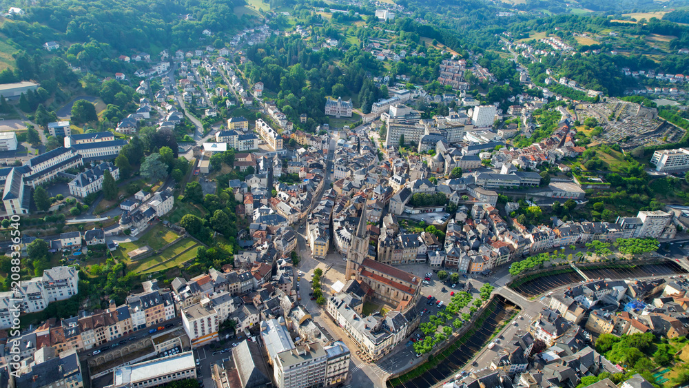 Obraz premium Aerial view of the old town above the city Tulle in France, on a sunny spring afternoon.