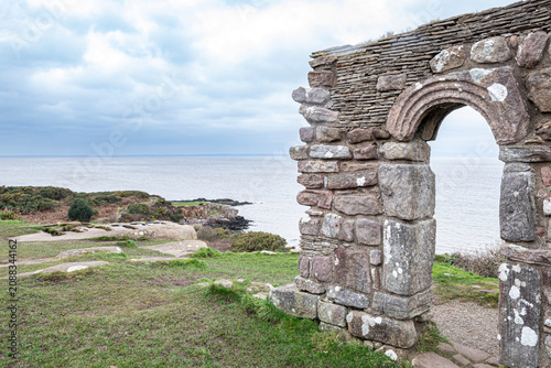 Tableau sur toile The ruins of St Patricks Chapel dating back to Anglo Saxon times perched above t