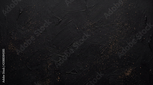 Matte Black Paint Texture Background with Bronze Dust Accents