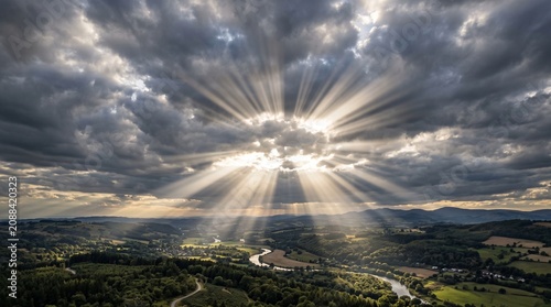Dramatic mountain landscape rugged peaks green slopes winding paths, cloudy sky beams of sunlight streaming illuminating valley river distance, symbolic representation of crepuscular rays, serenity, n