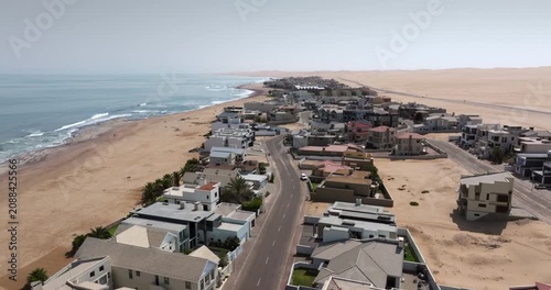 Aerial jib shot of Langstrand, a beach resort town between Swakopmund and Walvis Bay in the Namib Desert, Namibia.