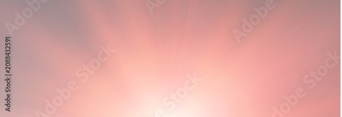 Soft pink and orange sunset sky background with abstract sunbeams from bottom for flyer and web design backdrop
