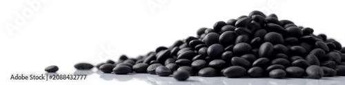 A large pile of black oil sunflower seeds against a pure white backdrop , isolated, image, plant
