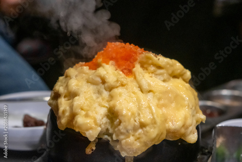 Steamed egg or Gyeran Jjim with ebiko or fish roe served in a bowl. Korean food