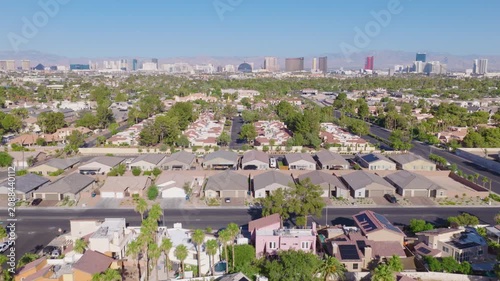 Las Vegas Neighborhood Pullback Aerial with Strip Skyline and Mountain View 02