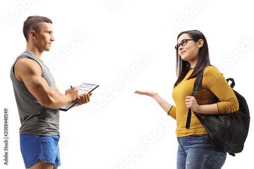 Fitness instructor and a female student having a conversation