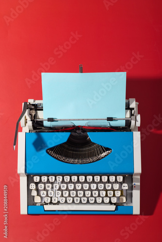 Closeup of a vintage typewriter on a red table