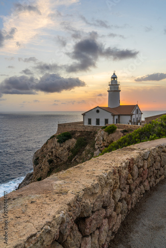 Sunrise at Capdepera Lighthouse in Mallorca, Spain. Golden light over Mediterranean coastline, scenic seascape, iconic coastal landmark, peaceful landscape and travel destination concept.