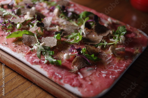 beef carpaccio with black truffle closeup view italian cuisine appetizer