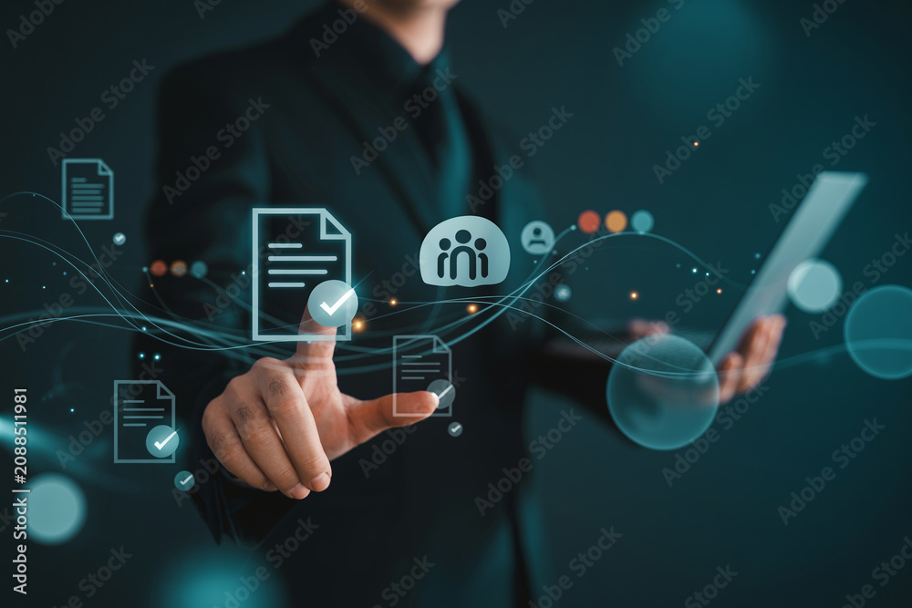 Fototapeta premium Businessman interacting with virtual digital document and workflow approval icons