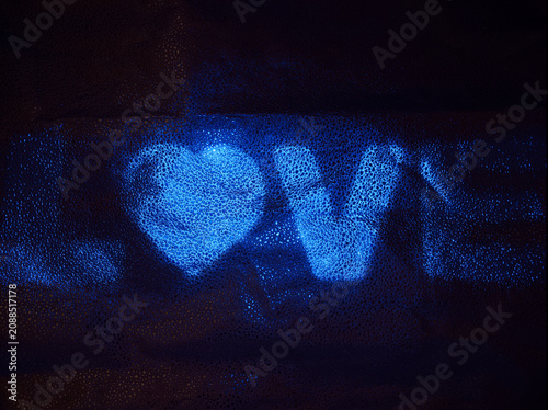 Принти на полотні Words of love are shown in bright blue on a dark background with bubbles in an a