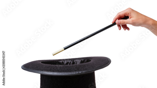 Quadro su tela Human hand holding magic wand over black top hat, isolated on transparent backgr