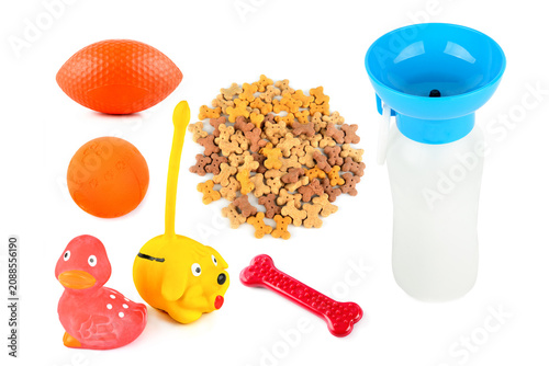 Картината върху платно Collection of pet toys, treats, and portable water dispenser isolated on white background