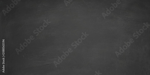 Fotografie Dark chalkboard texture background with subtle chalk stains and empty space for text copy space chalky blackboard