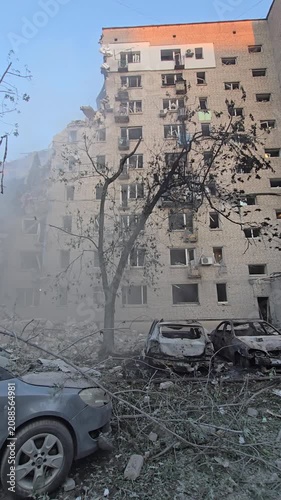 destroyed house and cars after rocket attack Kyiv, Ukraine, Darnytskyi district, 27a Novodarnytska Street
