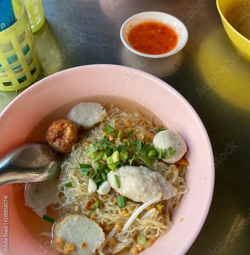 noodle soup. Thai noodle soup. Thai food. Asian food. Braised beef. Frish meatballs. Noodles. Hot broth. Chopsticks. Homemade food. Bowl of noodles. Comfort food.