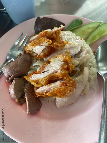 Hainanese chicken rice. Thai chicken rice. Thai food. Asian food. Boiled chicken. Fried chicken. Chicken rice. Rice dish. Traditional food. Chicken Rice.
