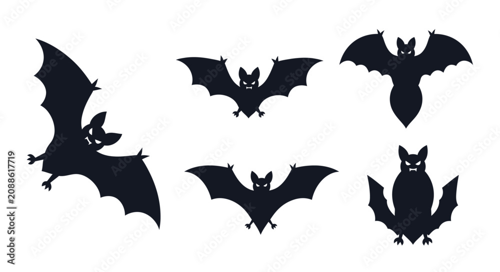 Fototapeta premium Five black silhouettes of bats and an owl in flight and perched.