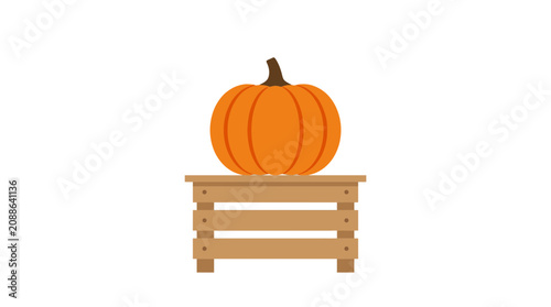 Fotografie Pumpkin on a wooden bench outside.