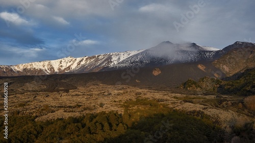 Snow-capped Etna peaks, volcano in soft morning light, snow-covered, occasional clouds in the sky, UNESCO World Heritage Site Etna, volcano, volcanism, Sicily, Italy