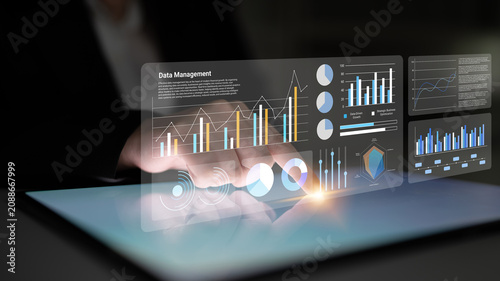 Foto A modern workspace showcases an innovative touchscreen interface for data management, featuring detailed graphs and charts that enhance analytical capabilities and decision-making