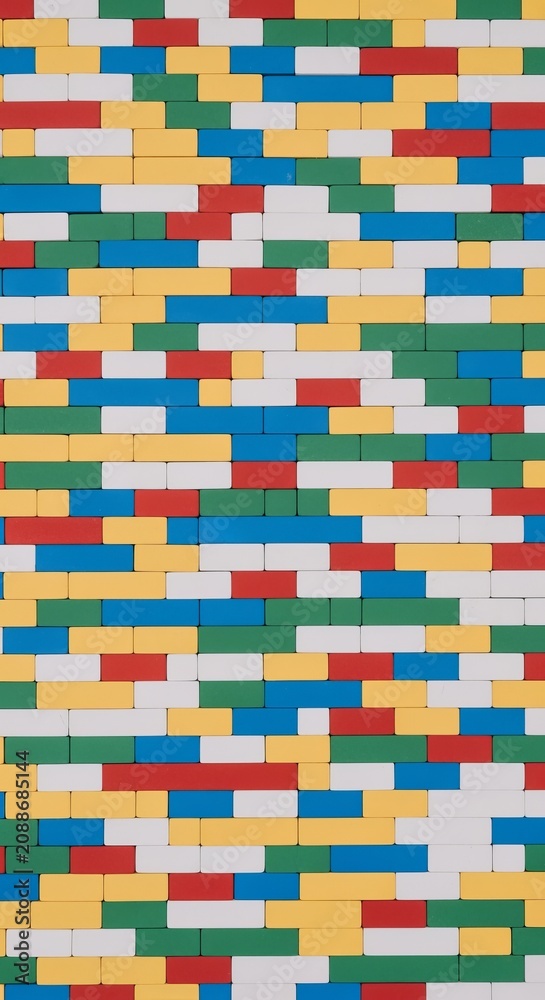 Obraz premium Vibrant top down flat lay of interlocking colorful lego bricks in primary colors with smooth texture