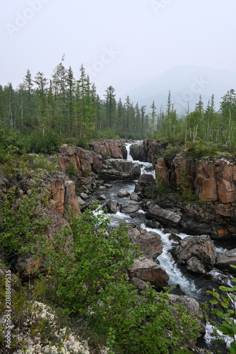 Mountain stream on a cloudy summer day.