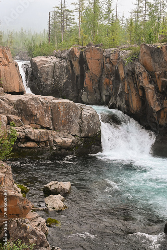 Mountain stream on a cloudy summer day.