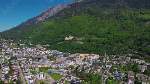 Aerial panoramic view above the downtown around the capitol city Vaduz in Liechtenstein on a sunny summer afternoon. 