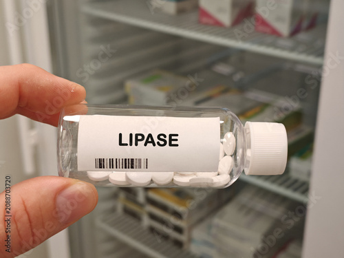 Tableau sur toile LIPASE digestive enzyme for fat digestion bottle with tablets in pharmacy