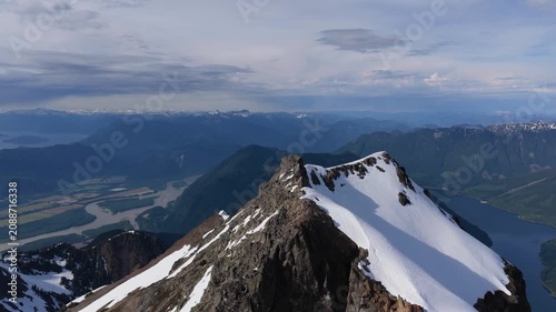 Stunning Aerial View of Snow-Capped Mountain Peaks, River, and Valley in British Columbia, Canada