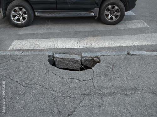 Obraz na plátně Asphalt collapse due to destruction of drainage system