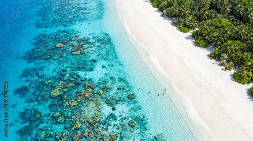 Aerial View of Tropical Island Paradise Beach with Turquoise Waters and Lush Green Jungle Vegetation