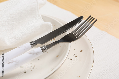 Knife and fork on ceramic p...