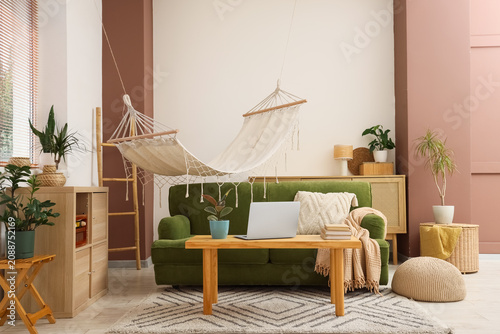 Cozy living room with green...