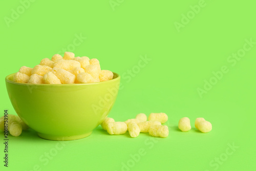 Bowl with sweet corn sticks...