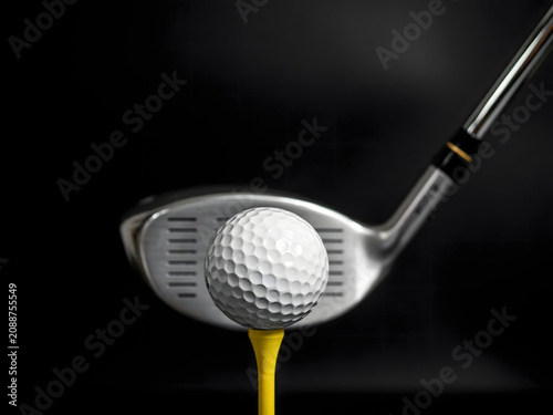 Golf club and ball on tee for golfing sports and recreation