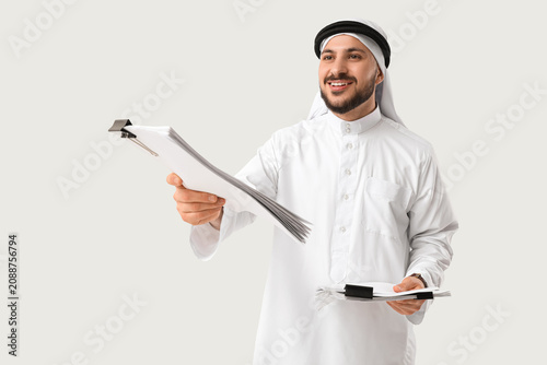 Arab businessman with paper...