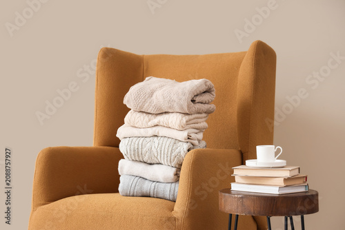 Stack of different warm clo...